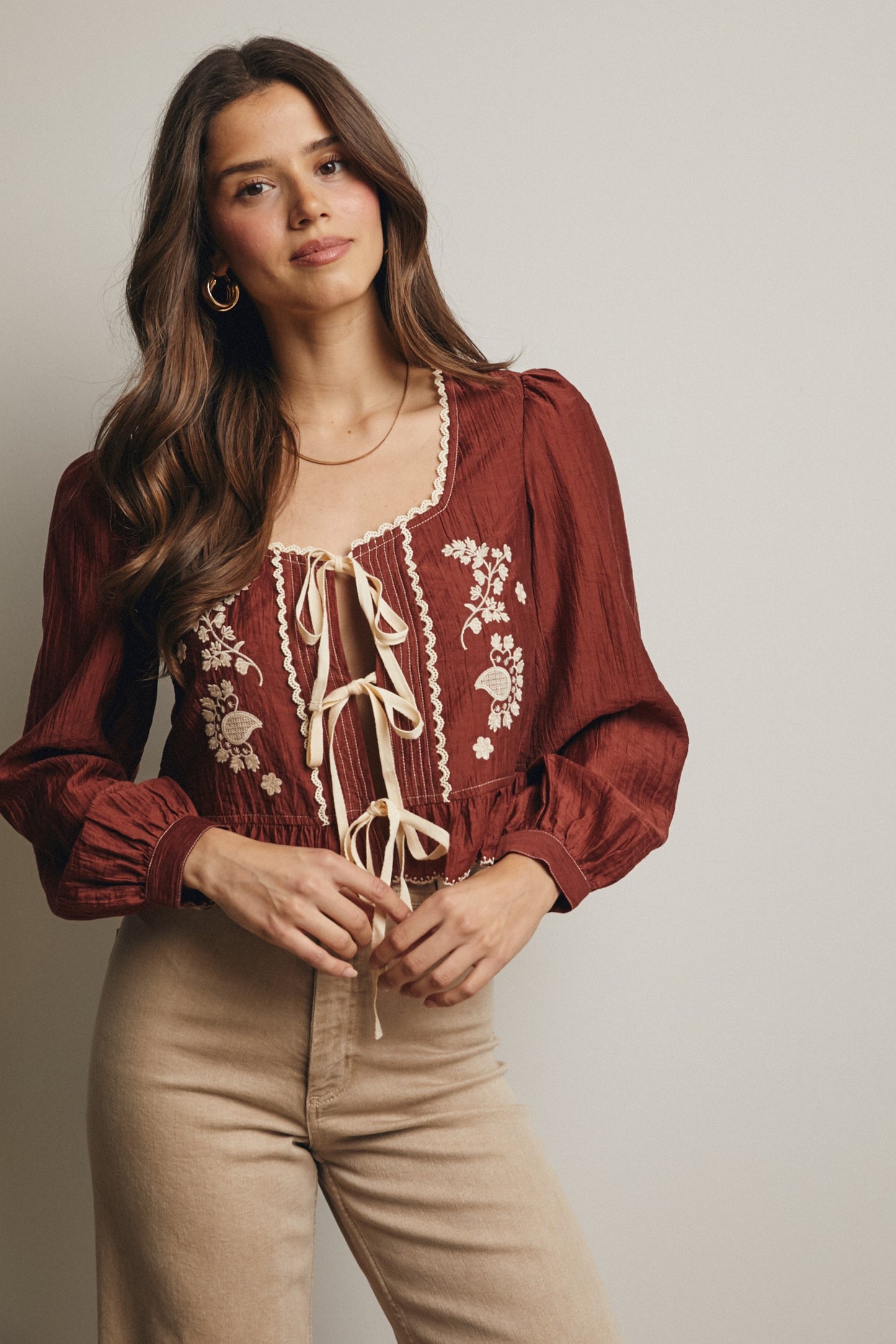 Embroidered Tie Front Peplum Blouse