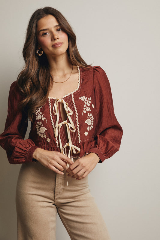 Embroidered Tie Front Peplum Blouse