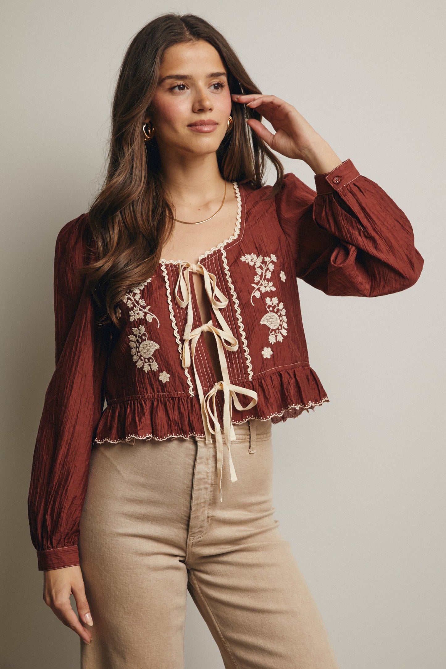 Embroidered Tie Front Peplum Blouse