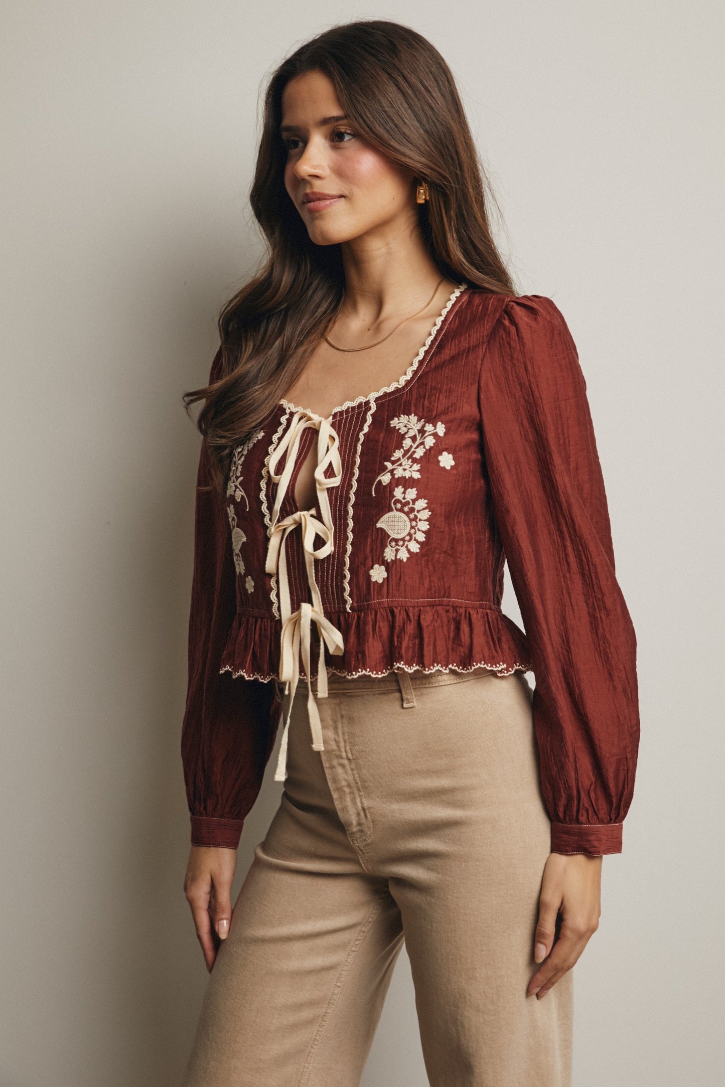 Embroidered Tie Front Peplum Blouse